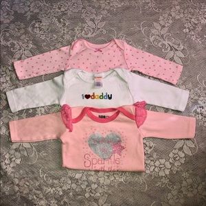 Bundle of babygirl long sleeve onesies (0-6 months).